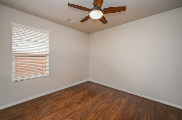 15111 Longleaf Forest Dr, Houston, TX 77090 - empty room featuring baseboards, visible vents, a ceiling fan, and dark wood finished floors