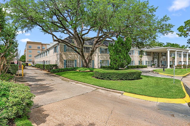 surrounding community featuring a gate and a lawn