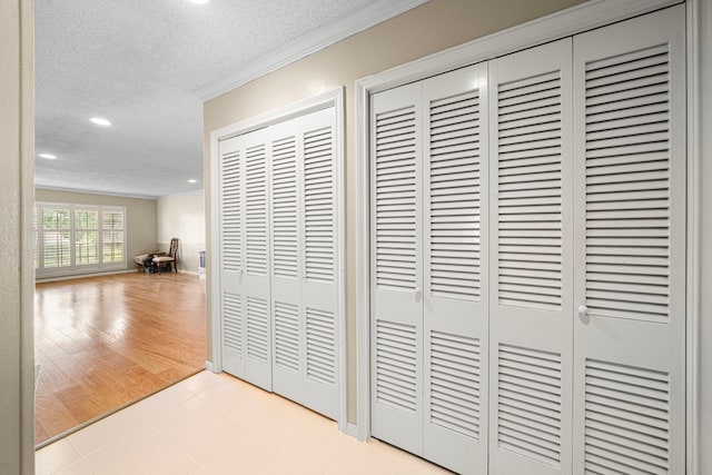 details featuring ornamental molding, recessed lighting, and a textured ceiling
