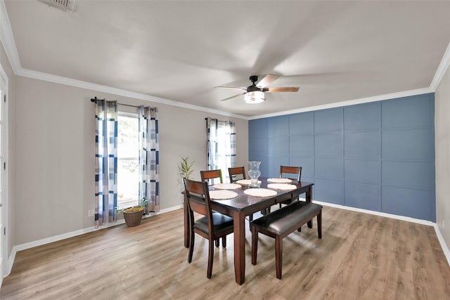 dining area featuring baseboards, ornamental molding, and ceiling fan