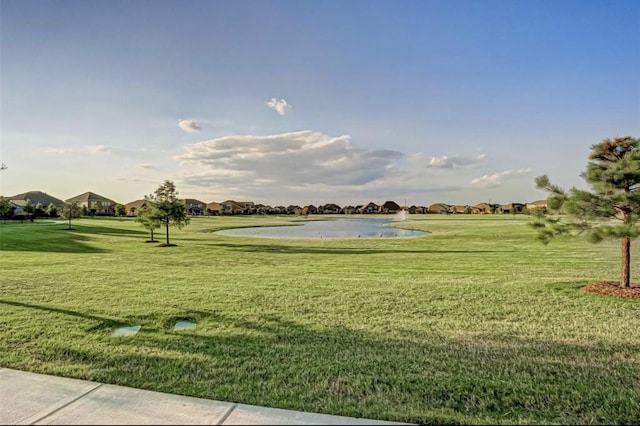 view of home's community with a yard and a residential view