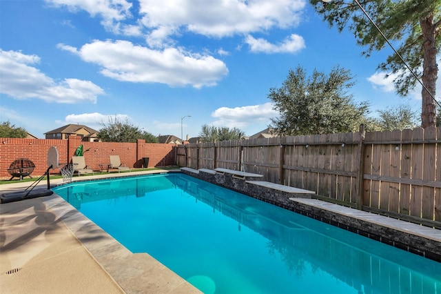 view of swimming pool with a fenced backyard and a fenced in pool