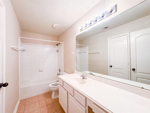 bathroom featuring washtub / shower combination, visible vents, toilet, tile patterned floors, and vanity