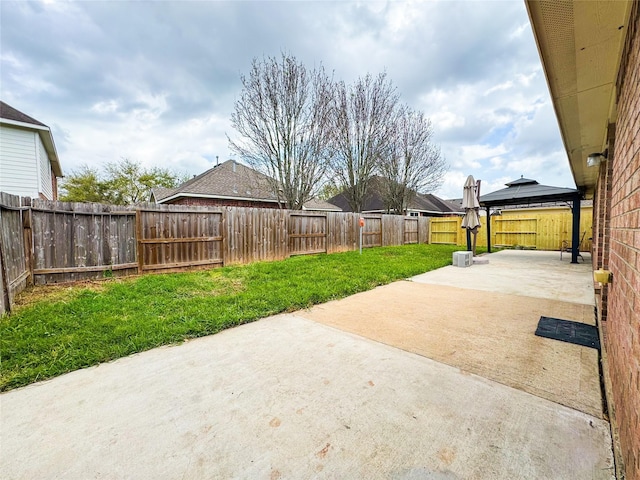 view of patio / terrace featuring a gazebo and a fenced backyard