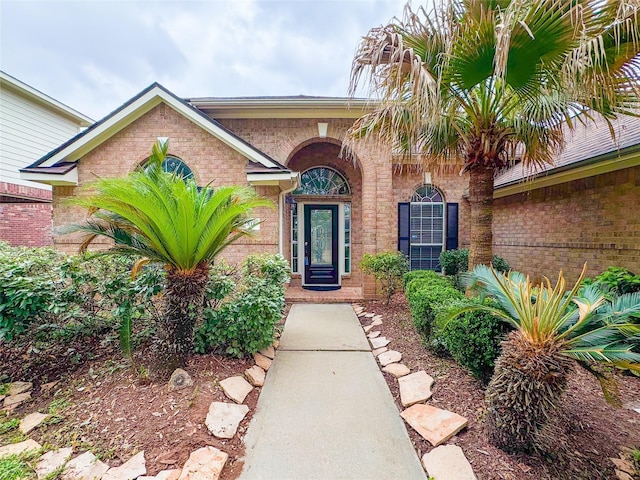 property entrance with brick siding