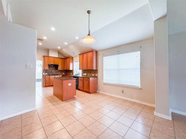 kitchen with lofted ceiling, light tile patterned floors, decorative backsplash, a kitchen island, and black dishwasher