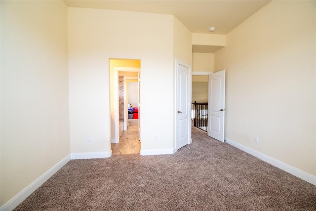 11823 Champions Forest Dr, Dayton, TX 77535 - unfurnished bedroom featuring carpet flooring and baseboards