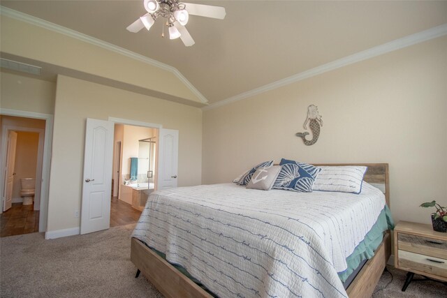 11823 Champions Forest Dr, Dayton, TX 77535 - carpeted bedroom featuring connected bathroom, vaulted ceiling, ceiling fan, baseboards, and crown molding