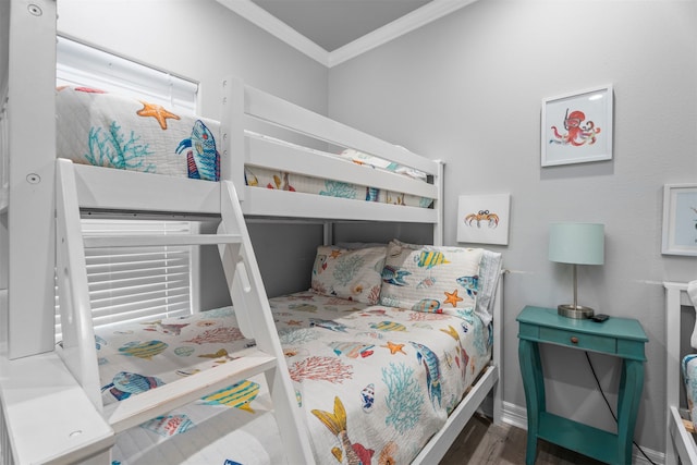 886 Sandollar, Crystal Beach, TX 77650 - bedroom with wood finished floors and crown molding