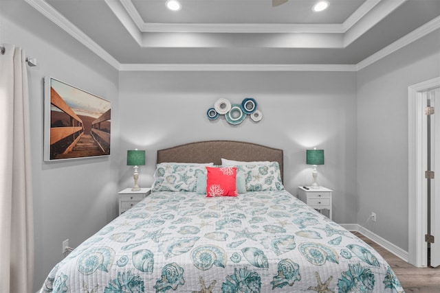 886 Sandollar, Crystal Beach, TX 77650 - bedroom with recessed lighting, a raised ceiling, crown molding, baseboards, and wood finished floors