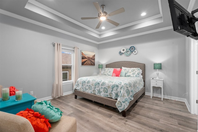 886 Sandollar, Crystal Beach, TX 77650 - bedroom featuring crown molding, a tray ceiling, baseboards, recessed lighting, and wood finished floors