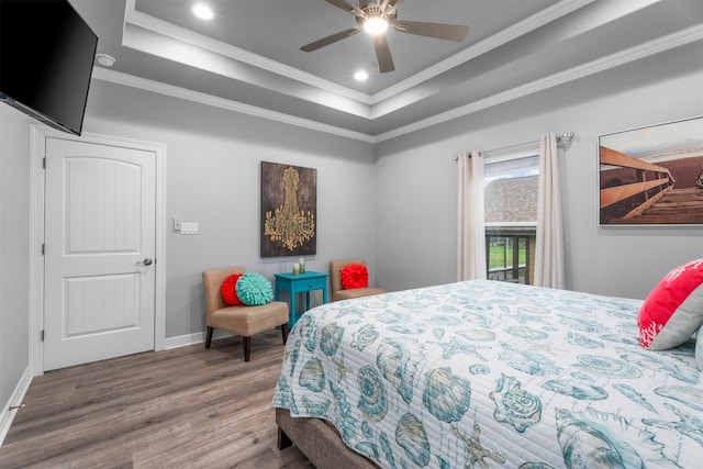 886 Sandollar, Crystal Beach, TX 77650 - bedroom featuring recessed lighting, a raised ceiling, baseboards, ornamental molding, and wood finished floors