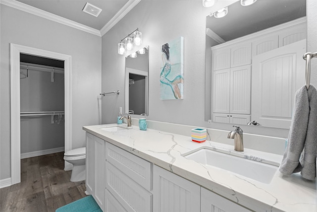 886 Sandollar, Crystal Beach, TX 77650 - full bathroom with wood finished floors, toilet, crown molding, and a sink