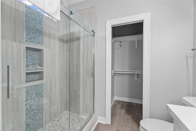 886 Sandollar, Crystal Beach, TX 77650 - full bath featuring a spacious closet, a stall shower, and toilet