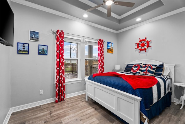 886 Sandollar, Crystal Beach, TX 77650 - bedroom featuring ornamental molding, recessed lighting, wood finished floors, and a tray ceiling