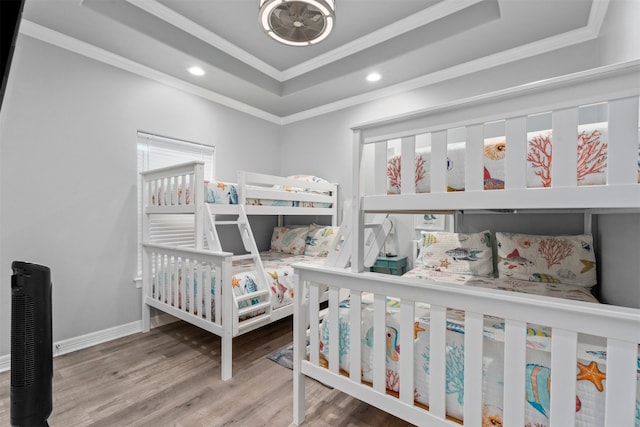 886 Sandollar, Crystal Beach, TX 77650 - bedroom featuring a tray ceiling, baseboards, recessed lighting, ornamental molding, and wood finished floors