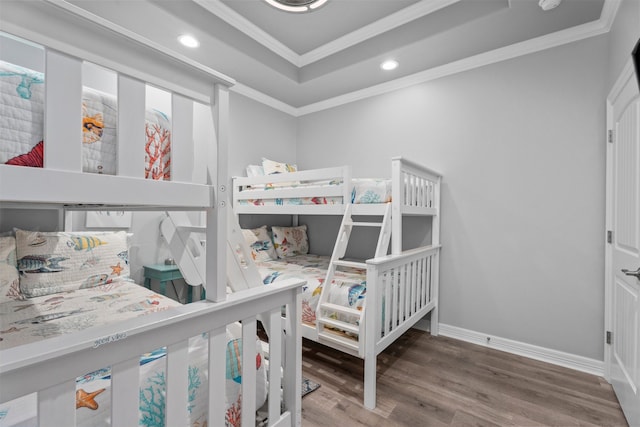 886 Sandollar, Crystal Beach, TX 77650 - bedroom featuring recessed lighting, wood finished floors, ornamental molding, baseboards, and a raised ceiling