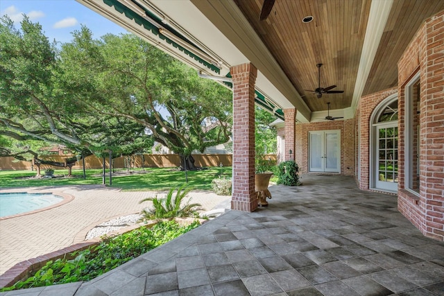 2 Wexford Ct, Piney Point Village, TX 77024 - fenced backyard featuring a ceiling fan, a patio, and french doors