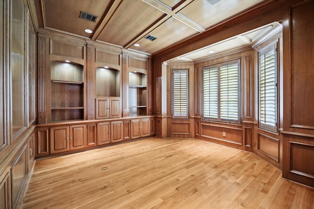 2 Wexford Ct, Piney Point Village, TX 77024 - spare room with crown molding, wood ceiling, light wood finished floors, a decorative wall, and built in shelves