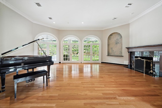 2 Wexford Ct, Piney Point Village, TX 77024 - sitting room featuring a premium fireplace, light wood-style floors, crown molding, recessed lighting, and baseboards