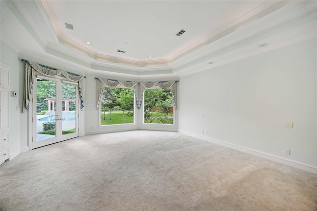 2 Wexford Ct, Piney Point Village, TX 77024 - spare room featuring french doors, a tray ceiling, crown molding, carpet flooring, and baseboards