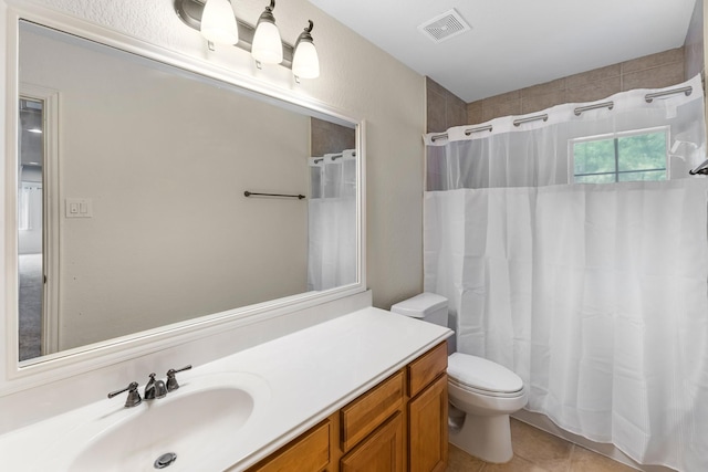 full bathroom featuring visible vents, tile patterned floors, a shower with curtain, and vanity