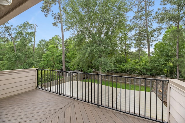 deck with a fenced backyard