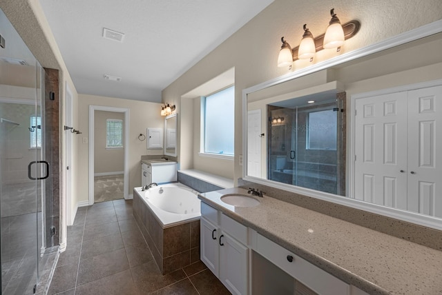 full bathroom with a shower stall, tile patterned flooring, and a garden tub