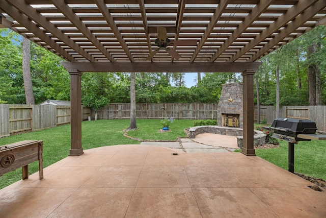 view of patio / terrace with an outdoor stone fireplace, a ceiling fan, a fenced backyard, and a pergola