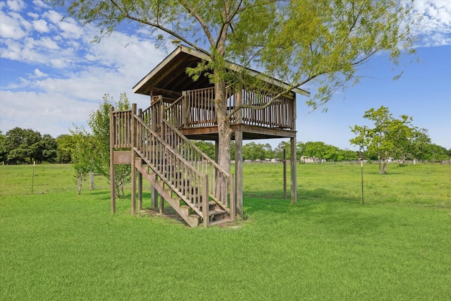 view of yard featuring a wooden deck and stairs