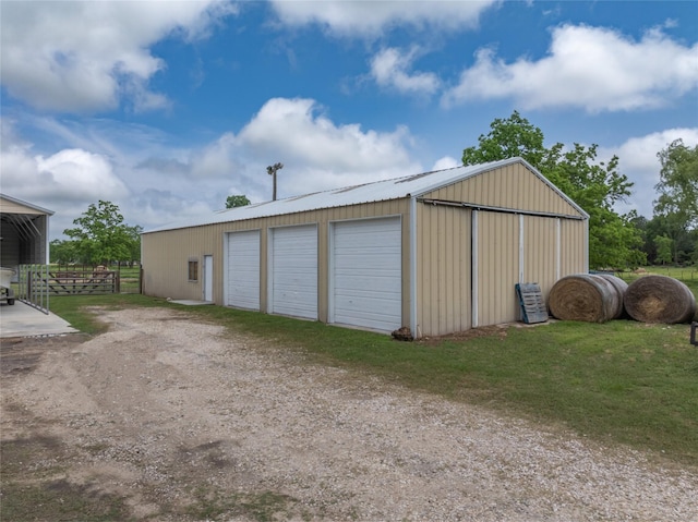 detached garage featuring fence