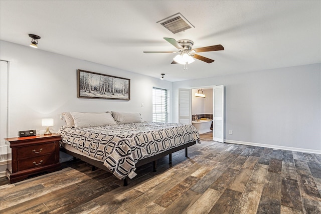 bedroom with wood-type flooring, ceiling fan, visible vents, baseboards, and ensuite bathroom
