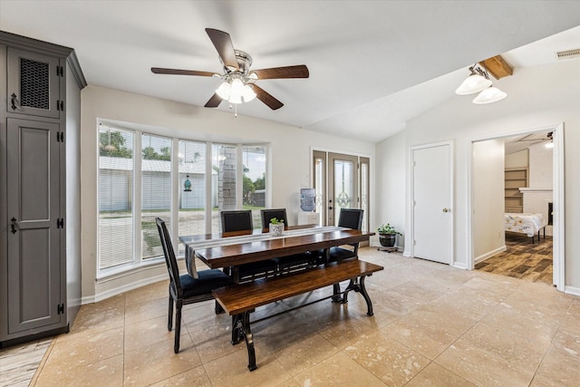 dining room with baseboards, vaulted ceiling with beams, ceiling fan, and french doors