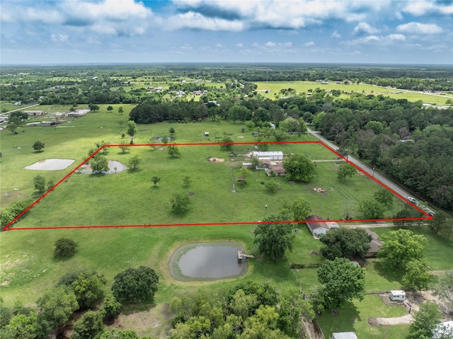 birds eye view of property with a rural view