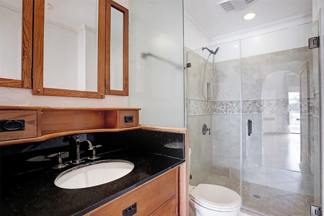 full bathroom with a shower stall, toilet, and vanity