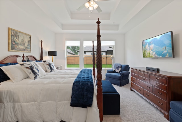1025 Mission River Dr, Conroe, TX 77304 - bedroom with a raised ceiling, ceiling fan, and carpet floors