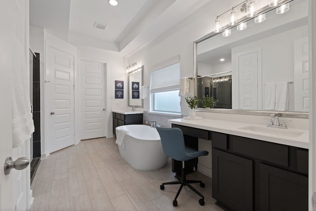 1025 Mission River Dr, Conroe, TX 77304 - bathroom with a soaking tub, visible vents, a shower stall, and a sink