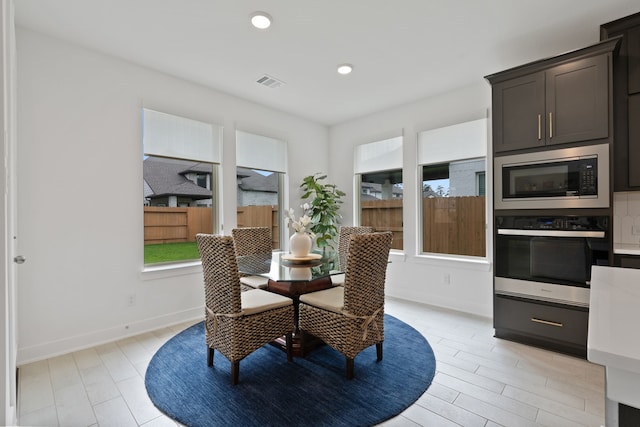 1025 Mission River Dr, Conroe, TX 77304 - dining area with recessed lighting, visible vents, baseboards, and a healthy amount of sunlight