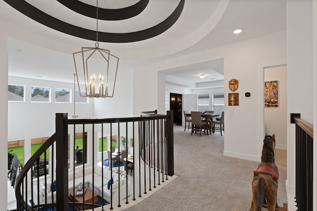 1025 Mission River Dr, Conroe, TX 77304 - corridor with recessed lighting, an upstairs landing, a notable chandelier, a tray ceiling, and carpet