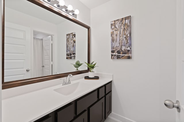 1025 Mission River Dr, Conroe, TX 77304 - bathroom featuring vanity and baseboards