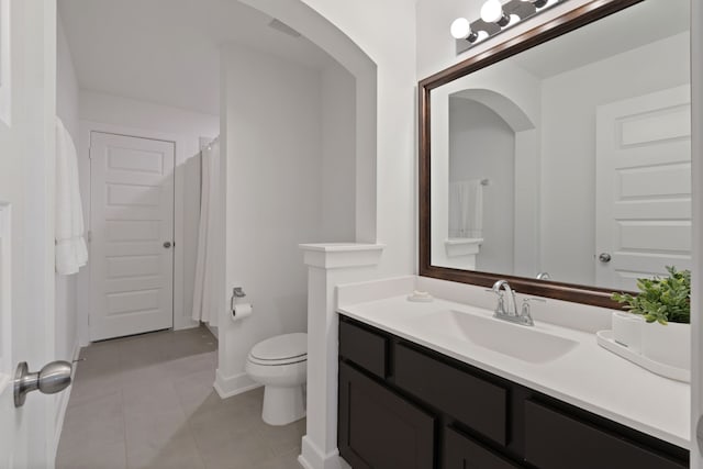 1025 Mission River Dr, Conroe, TX 77304 - full bathroom with tile patterned floors, toilet, vanity, baseboards, and curtained shower