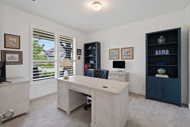 1025 Mission River Dr, Conroe, TX 77304 - home office featuring baseboards and light carpet