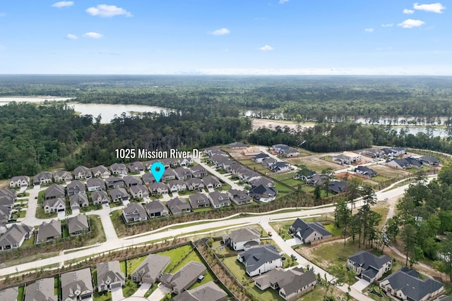 1025 Mission River Dr, Conroe, TX 77304 - aerial view with a residential view, a water view, and a view of trees