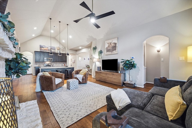 8143 Black Percher St, Conroe, TX 77385 - living room with arched walkways, a ceiling fan, wood finished floors, high vaulted ceiling, and recessed lighting