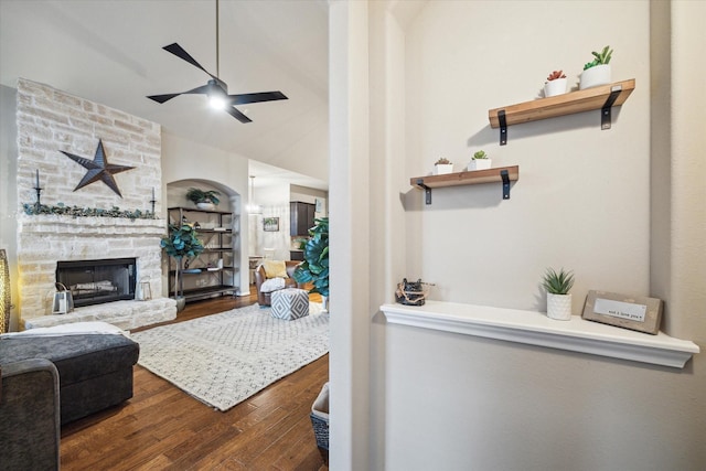 8143 Black Percher St, Conroe, TX 77385 - living room featuring ceiling fan, wood finished floors, and a stone fireplace