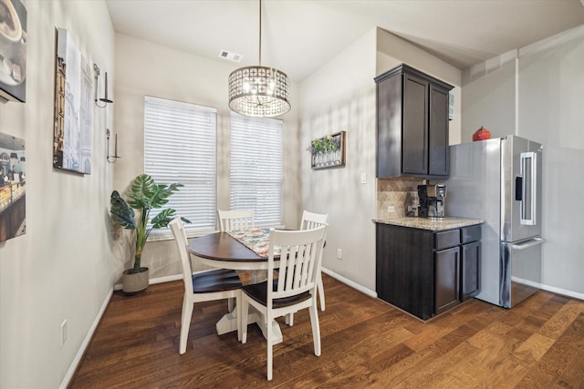 8143 Black Percher St, Conroe, TX 77385 - dining space featuring baseboards, dark wood-style floors, and a chandelier
