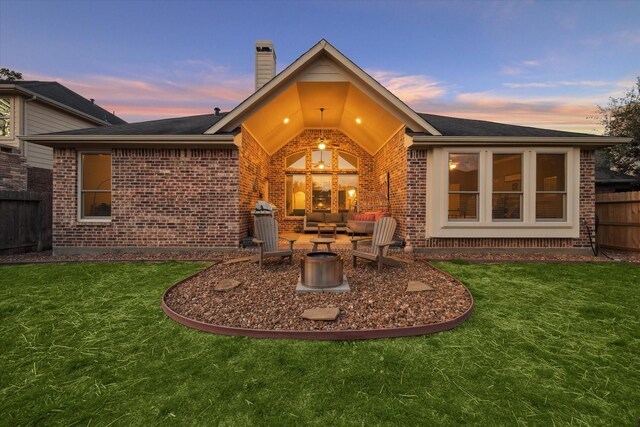 8143 Black Percher St, Conroe, TX 77385 - rear view of property with brick siding, an outdoor living space, and a chimney