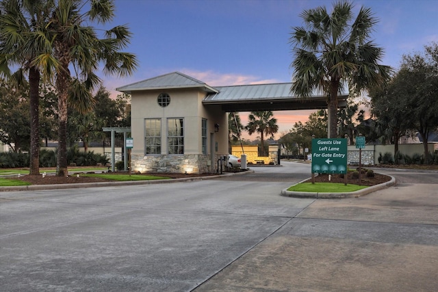 8143 Black Percher St, Conroe, TX 77385 - property at dusk featuring curved driveway
