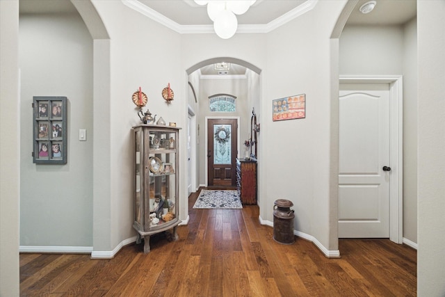 8143 Black Percher St, Conroe, TX 77385 - foyer with wood finished floors, baseboards, crown molding, and arched walkways