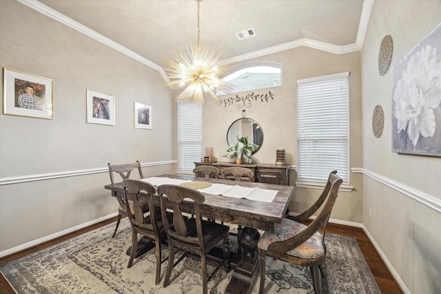 8143 Black Percher St, Conroe, TX 77385 - dining room with a chandelier, wood finished floors, ornamental molding, baseboards, and lofted ceiling